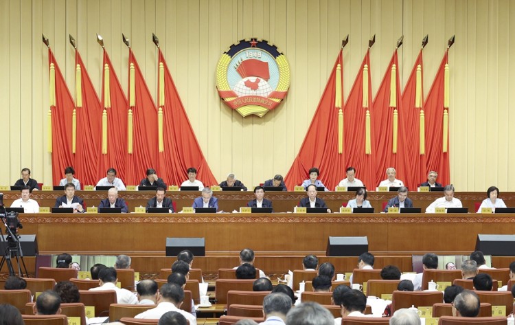 全国政协十四届常委会第八次会议举行全体会议 王沪宁出席